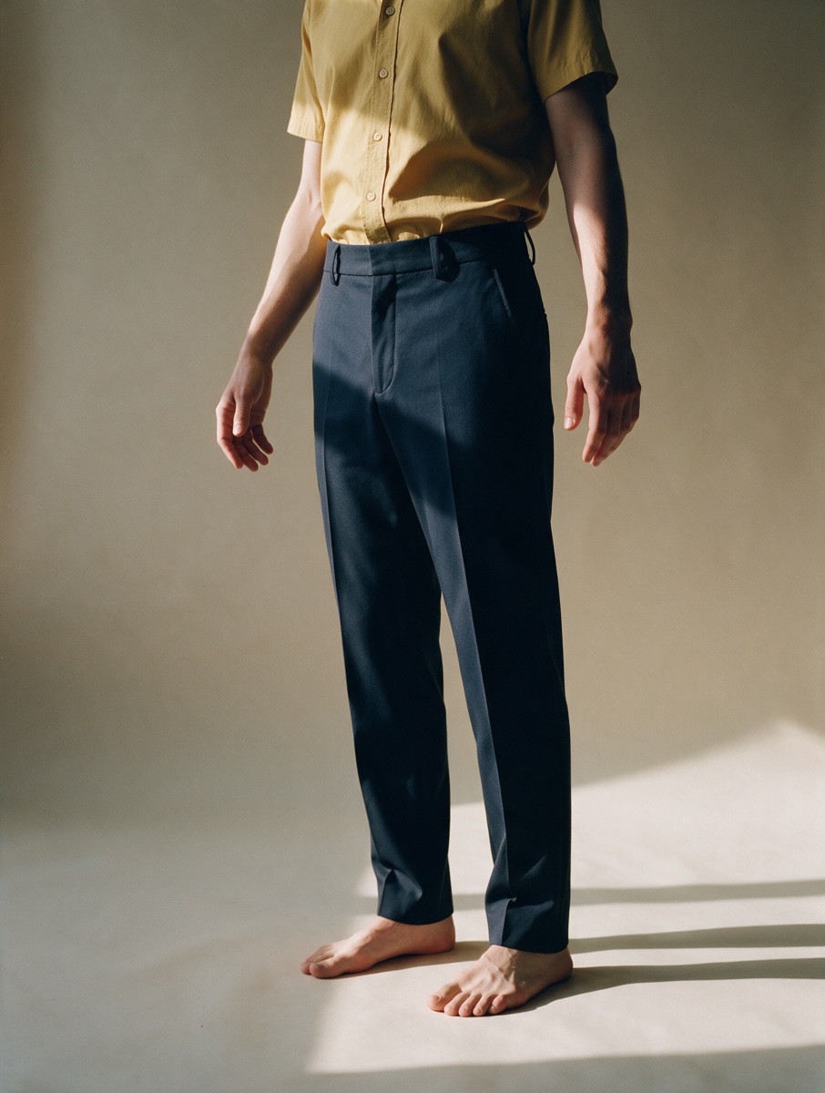 Mustard shirt and navy trousers, worn