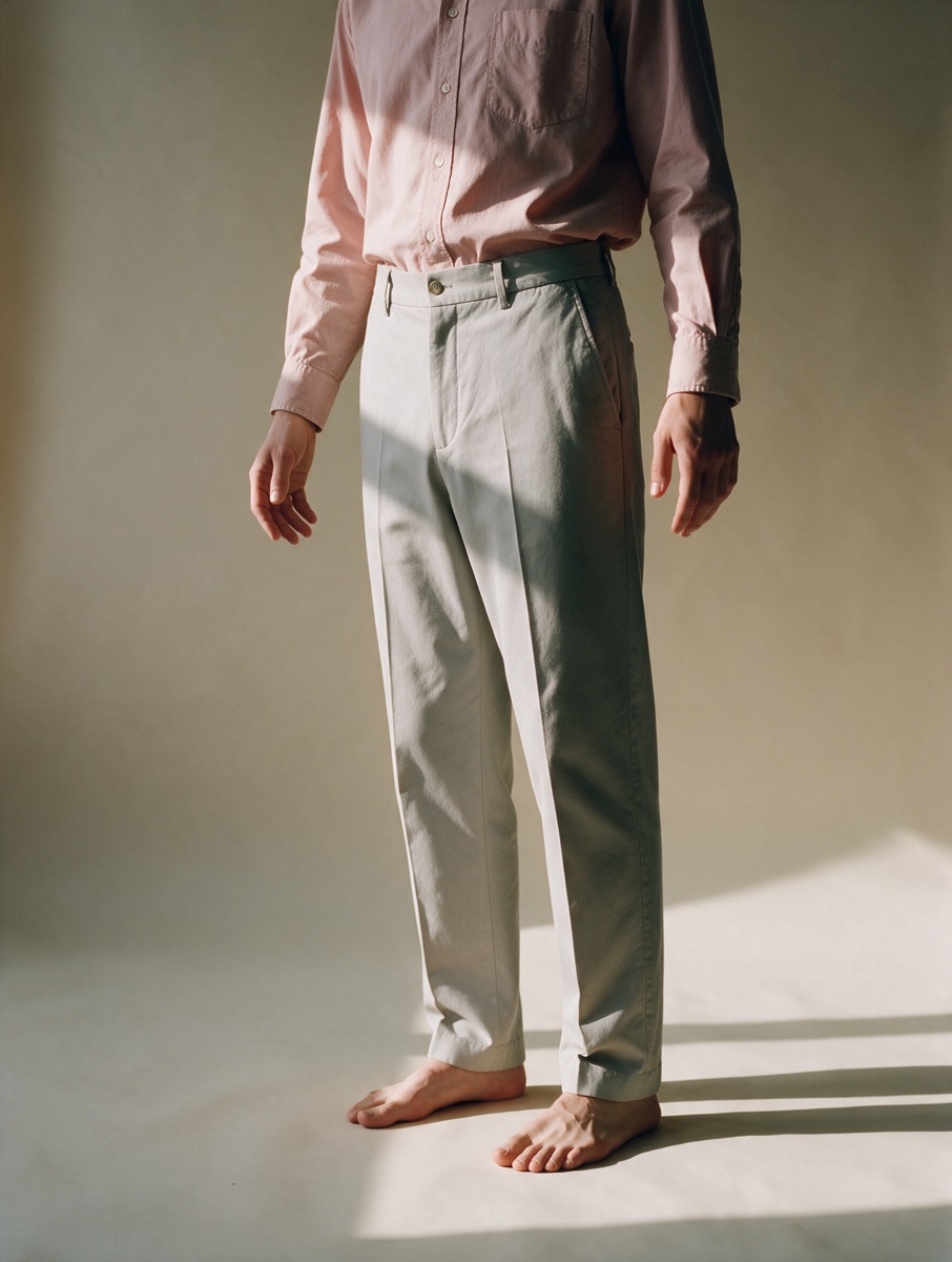 Dusty pink shirt and grey trousers, worn